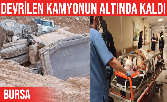 İnegöl'de devrilen kamyonun altında kalan sürücü yaralandı